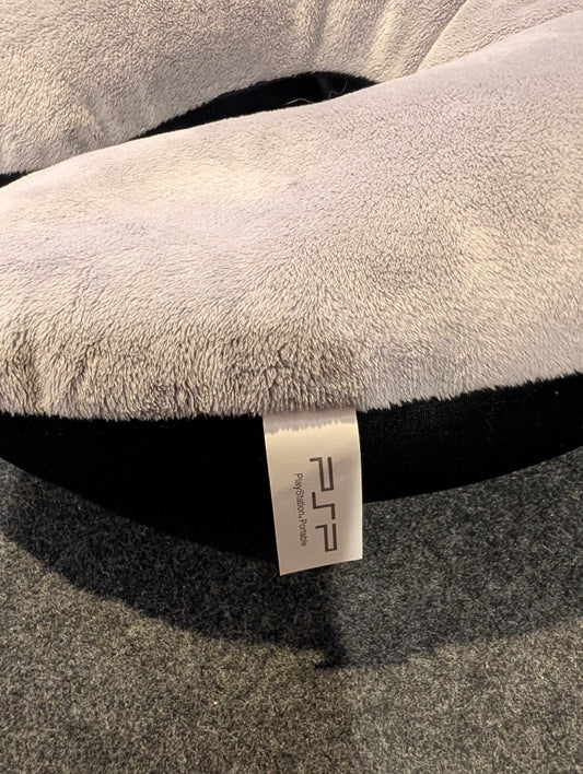 Sony PlayStation Portable (PSP) promotional plush neck travel pillow.